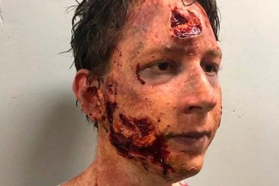 Male zombie makeup behind the scenes of containment