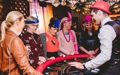Guests playing Blackjack at a Gatsby party