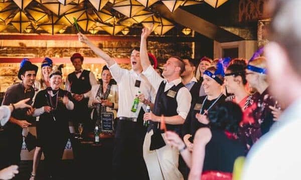 Guests cheering at Gatsby Gamble casino night