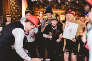 Guests cheering during a game at Gatsby themed party
