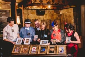 Guests standing in front of artworks