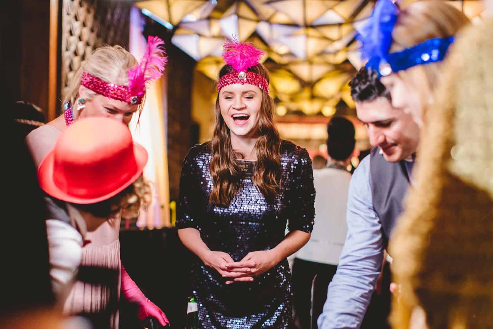 Woman laughing during Gatsby Gamble event