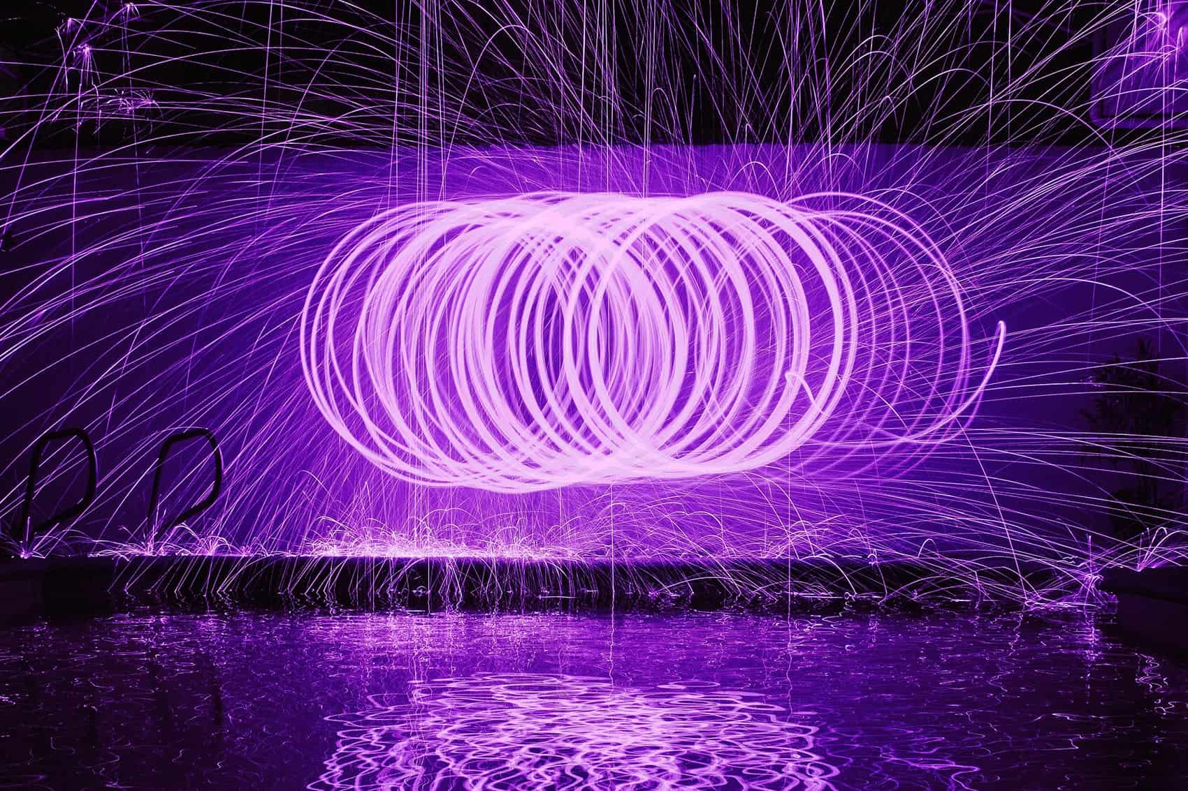 Purple sparks in circular patterns