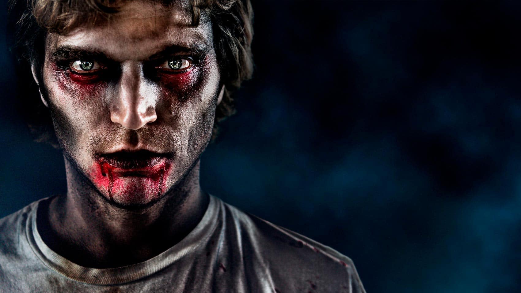 Male Containment zombie with dramatic lighting against blue background