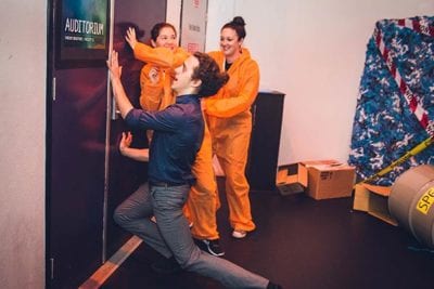 Containment door hold closed Players and actor holding door closed during zombie game