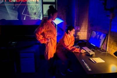 Players using a computer in lab during Containment game