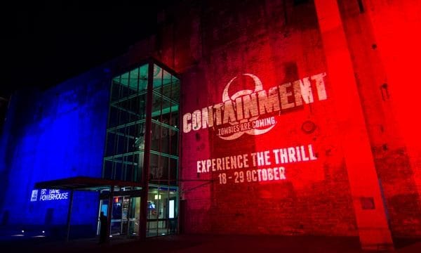 Containment Powerhouse logo Containment logo projected on Brisbane Powerhouse wall