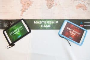 2 tablets on world map ready for team activity