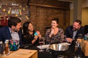 Players sabotaging each other in competitive wine tasting game