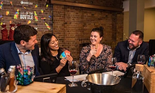 Players sabotaging each other in competitive wine tasting game