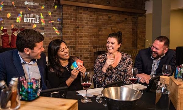 Out of the Bottle sabotage Players sabotaging each other in competitive wine tasting game