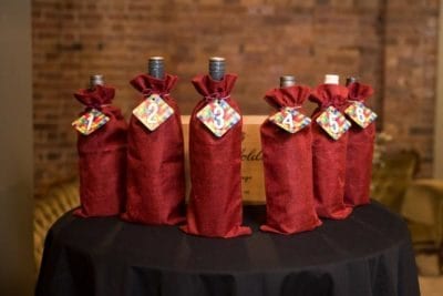 6 bottles of wine in covers for blind wine tasting