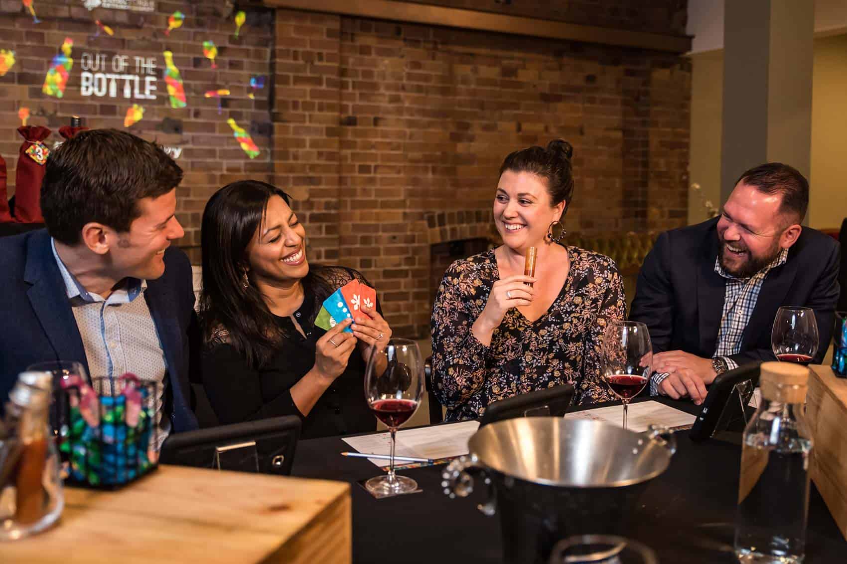 Guests laughing during competitive wine tasting experience