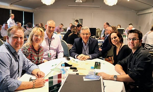 Personality profiling link Group of people doing personality profiling at a table
