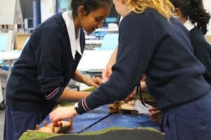 Students solving river crossing puzzle during incursion