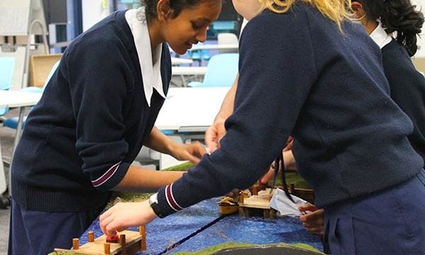 Students solving river crossing puzzle during incursion