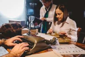 Close up of using a typewriter in team detective activity