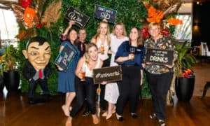 Group of guests at photo wall during beer tasting event