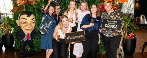 Group of guests at photo wall during beer tasting event