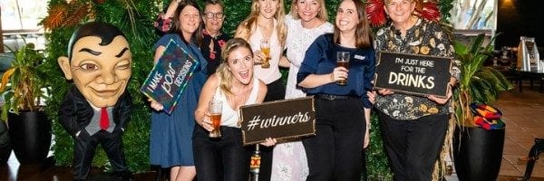 Group of guests at photo wall during beer tasting event
