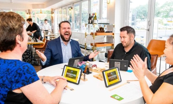 Man laughing during cheese tasting game