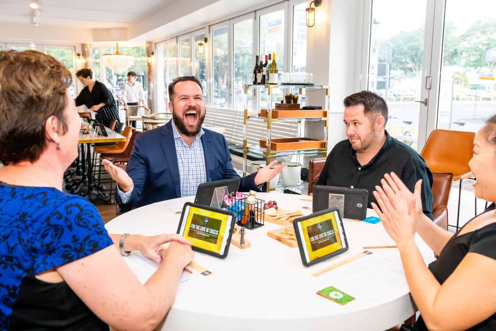 Man laughing during cheese tasting game