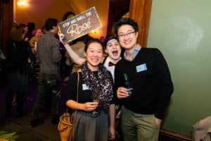 2 guests and an actor posing for the camera during networking